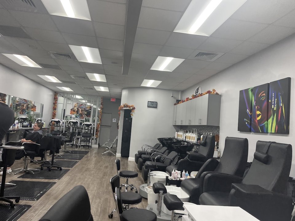 Clean salon interior with hair service stations.